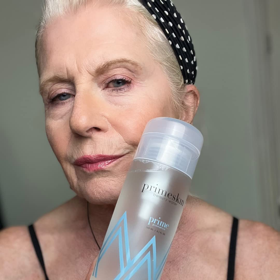 PRIME PROMETICS bottle in hand for scale and easy application benefit