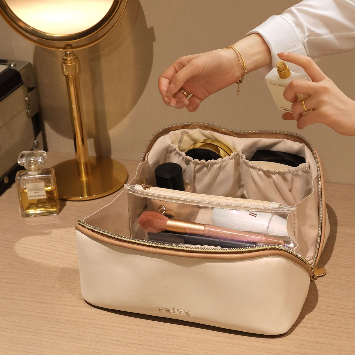 Prite lifestyle shot on suitcase showing travel-ready design and effortless packing benefit