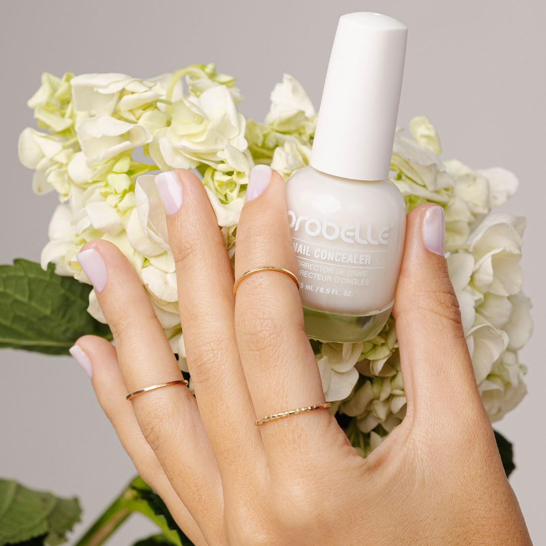 Probelle swatch on nail wheel shows sheer milky coverage options