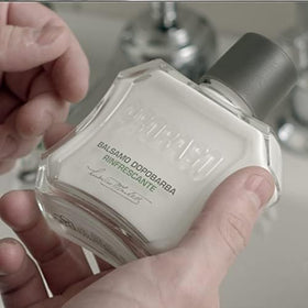 Proraso balm on bathroom shelf in grooming setup suggesting daily barbershop-style refresh