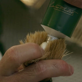 Proraso shaving brush applying creamy lather, improving razor glide and comfort
