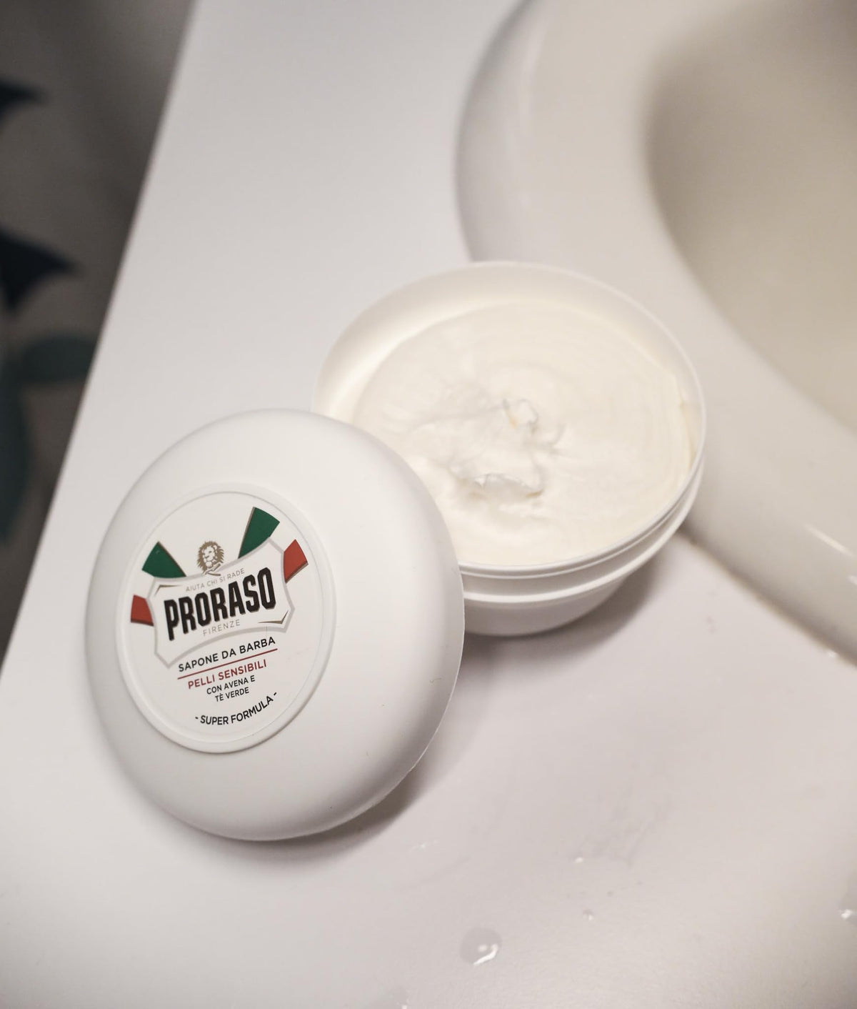 Proraso lifestyle bathroom shelf display communicating premium Italian grooming benefit