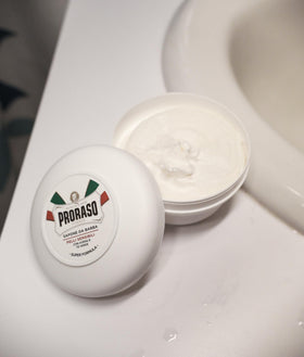 Proraso lifestyle bathroom shelf display communicating premium Italian grooming benefit