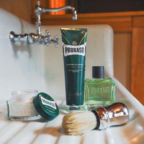 Proraso tube open with cream visible, showing thick texture for superior glide