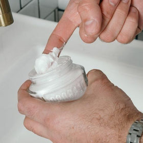 Proraso jar in hand illustrating 3.6oz scale and travel-friendly size