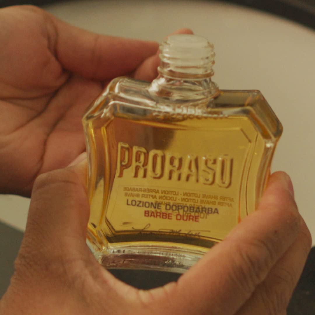Proraso 3.4 oz bottle in hand showing size and travel-friendly convenience