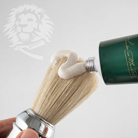 Man applying Proraso cream at sink for a smoother, less irritating shave