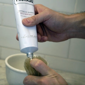 Proraso 5.2oz tube beside common items to show size and travel convenience