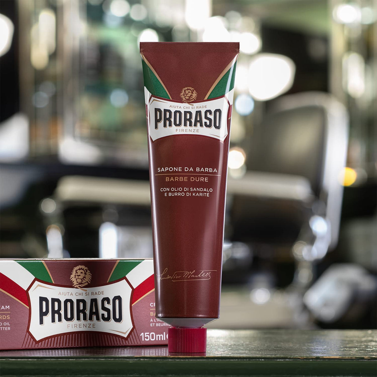 Proraso tube held in hand indicating compact 5.2oz travel-friendly size