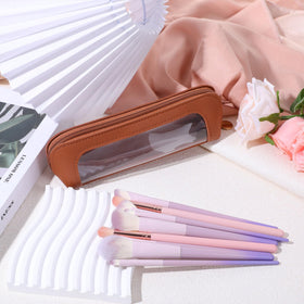 Psyqtsuary pouch next to smartphone showing slim size and travel convenience