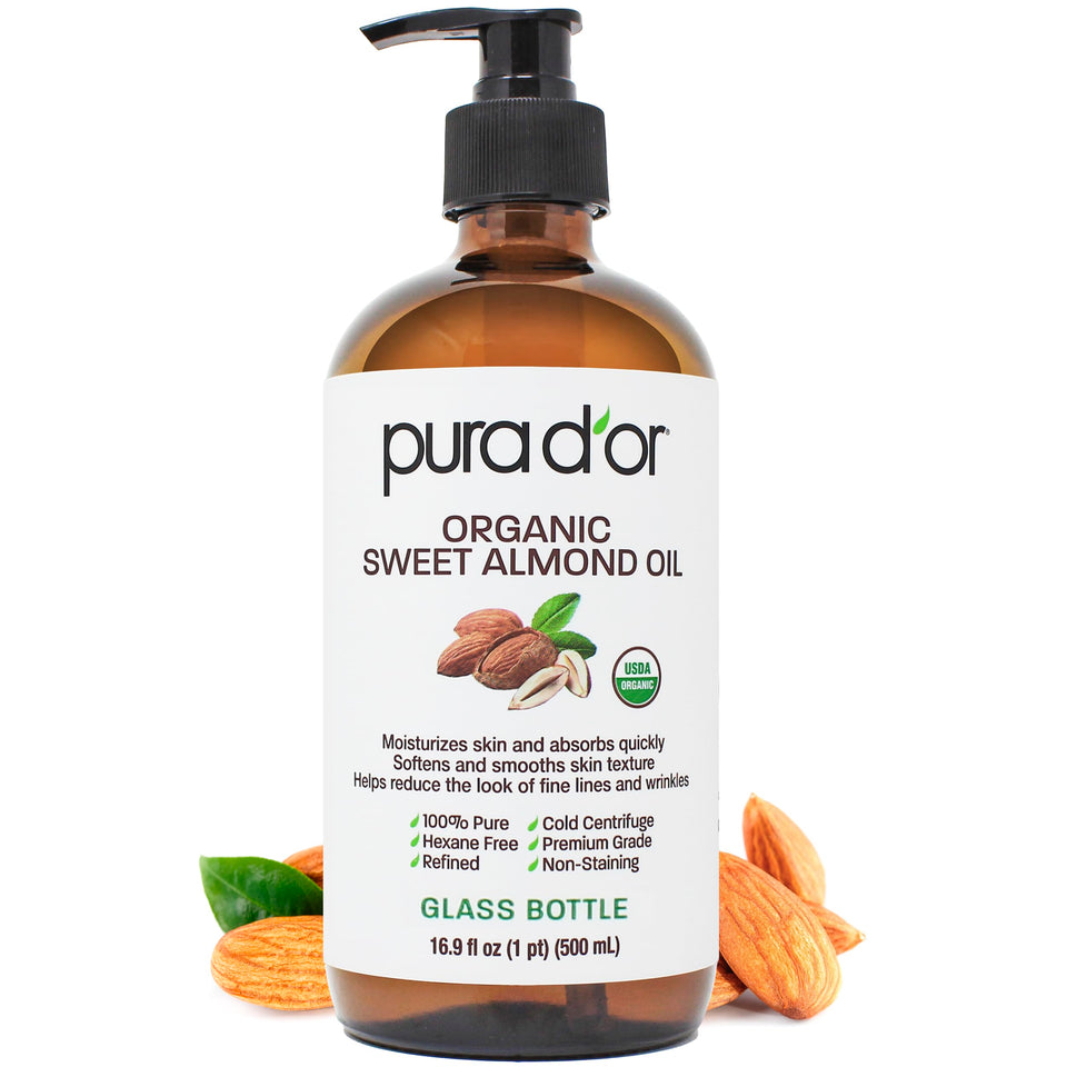PURA D'OR front glass bottle showing organic oil and clear branding, promotes natural care