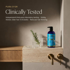 PURA D'OR lathering in shower on wet hair, illustrates moisturizing scalp care