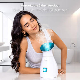 Pure Daily Care NanoSteamer warming a towel in a bathroom lifestyle scene for soothing compresses