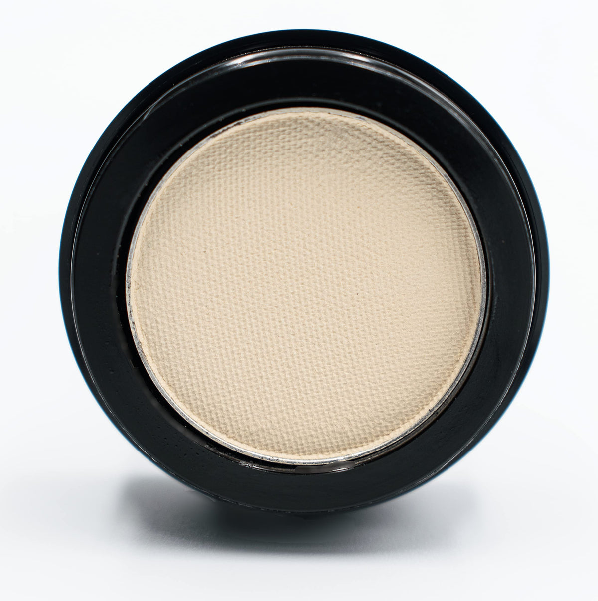 Pure Ziva compact held beside a coin showing size and travel-friendly benefit