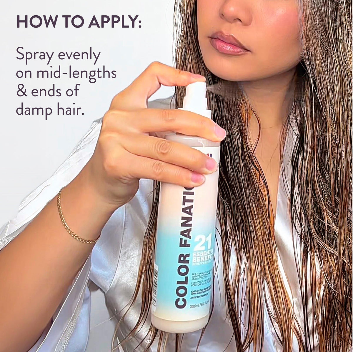 Pureology bottle in hand for scale to show travel-friendly size and convenience