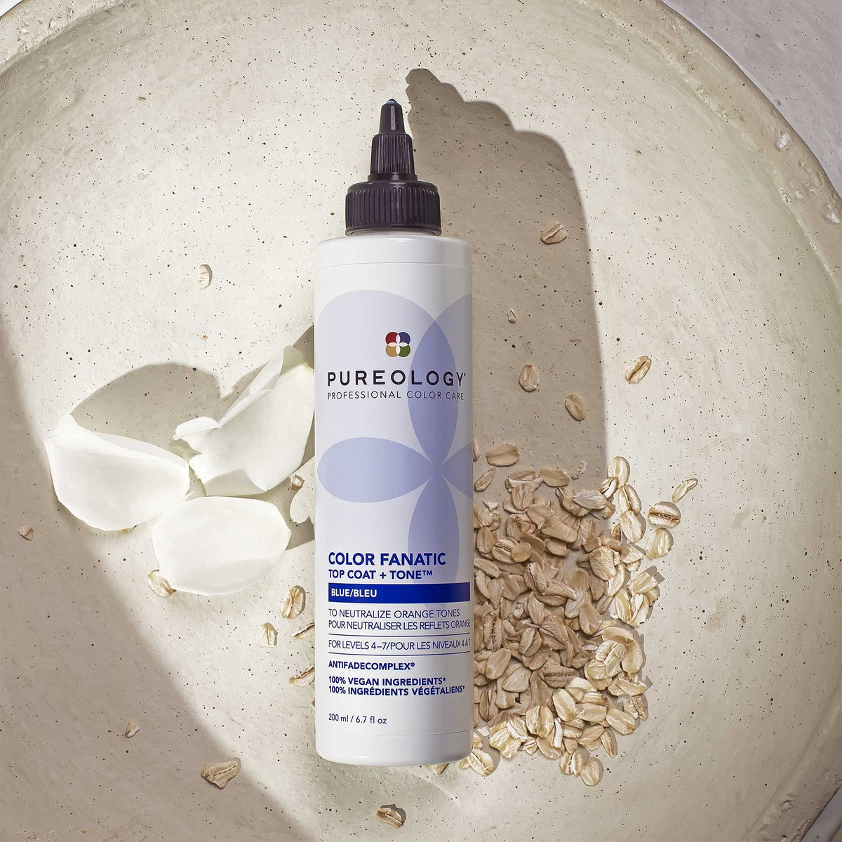 Pureology bottle on a bathroom shelf in lifestyle scene showing salon-quality at home benefit