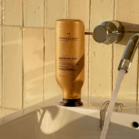 Pureology 9 fl oz size next to common bottle for scale and travel-friendly portability