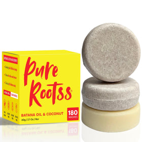 PureRootss Batana oil with hibiscus flowers highlighting nourishing oils and antioxidant-rich benefits