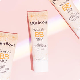 pūrlisse Perfect Glow being applied with fingers demonstrating easy blending and natural coverage
