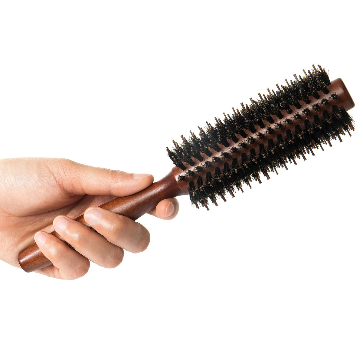 puto brush in use with blow dryer, creates curls and adds volume