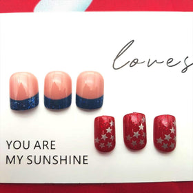 PXUEZAY detail of white stars on nails showing festive accent and visibility