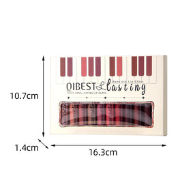 QiBest tubes beside a hand to show real-life size and portability