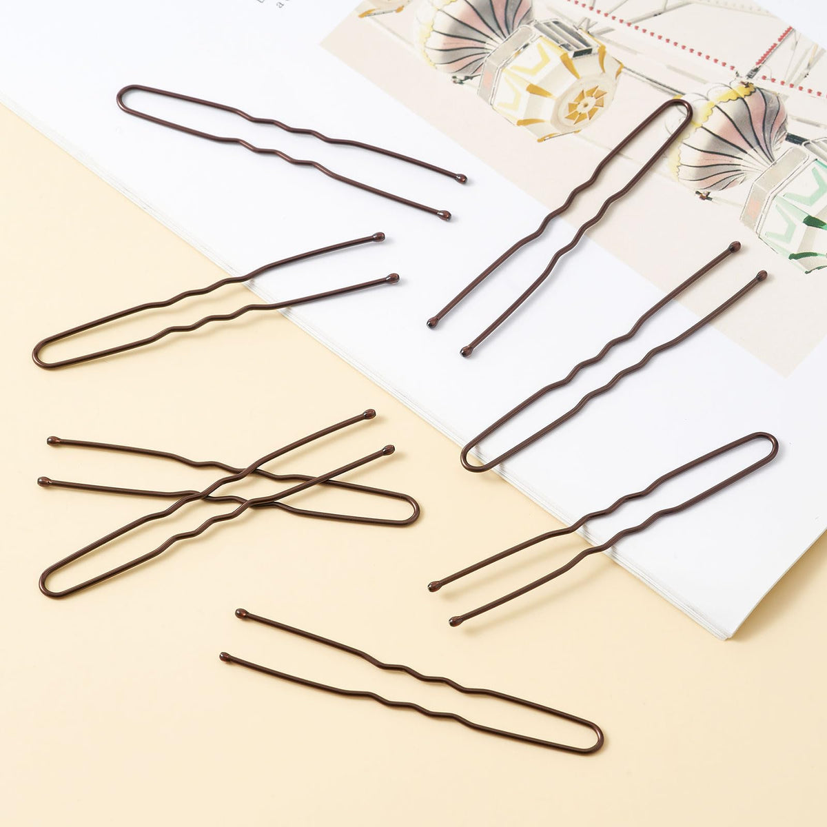 QIUTIMIY close-up of smooth metal tips showing rust-resistant finish and scalp-friendly design