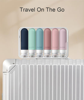 Quatish bottles neatly arranged inside a toiletry bag for organized TSA-friendly packing