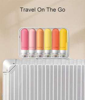 Quatish bottle held in hand to show 3 oz TSA-approved size for carry-on convenience
