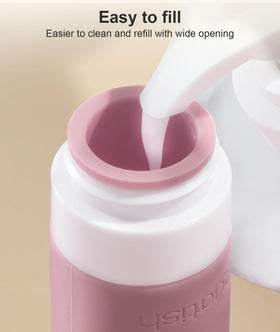 Quatish spray bottle being used to mist product for travel convenience