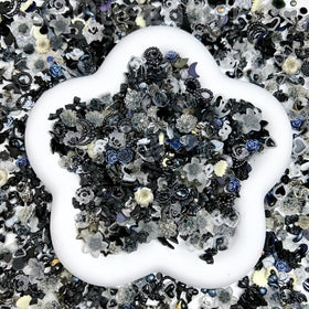 Quezadyl close-up of resin roses and dark bows highlighting fine detail and shine