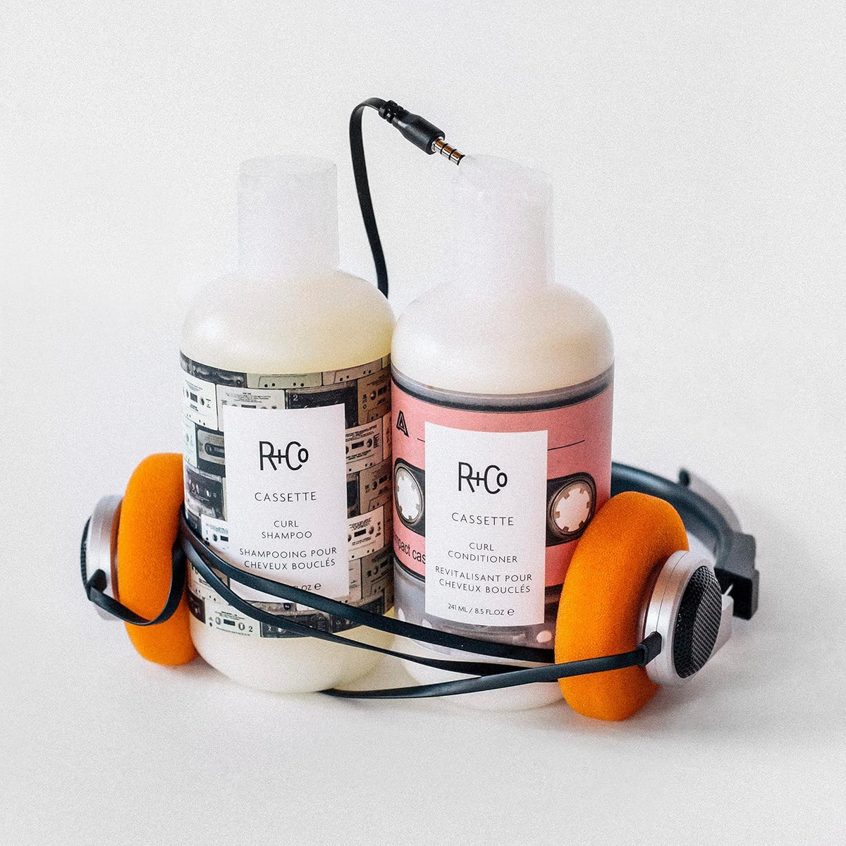 R+Co conditioner creamy texture on fingertip, moisturizing slip and detangling benefit