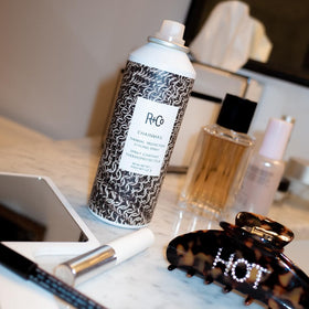 R+Co Chainmail being sprayed on damp hair to protect before blow-drying