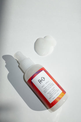 R+Co Hot Spell texture close-up of balm turning creamy, shows silky slip and easy spread