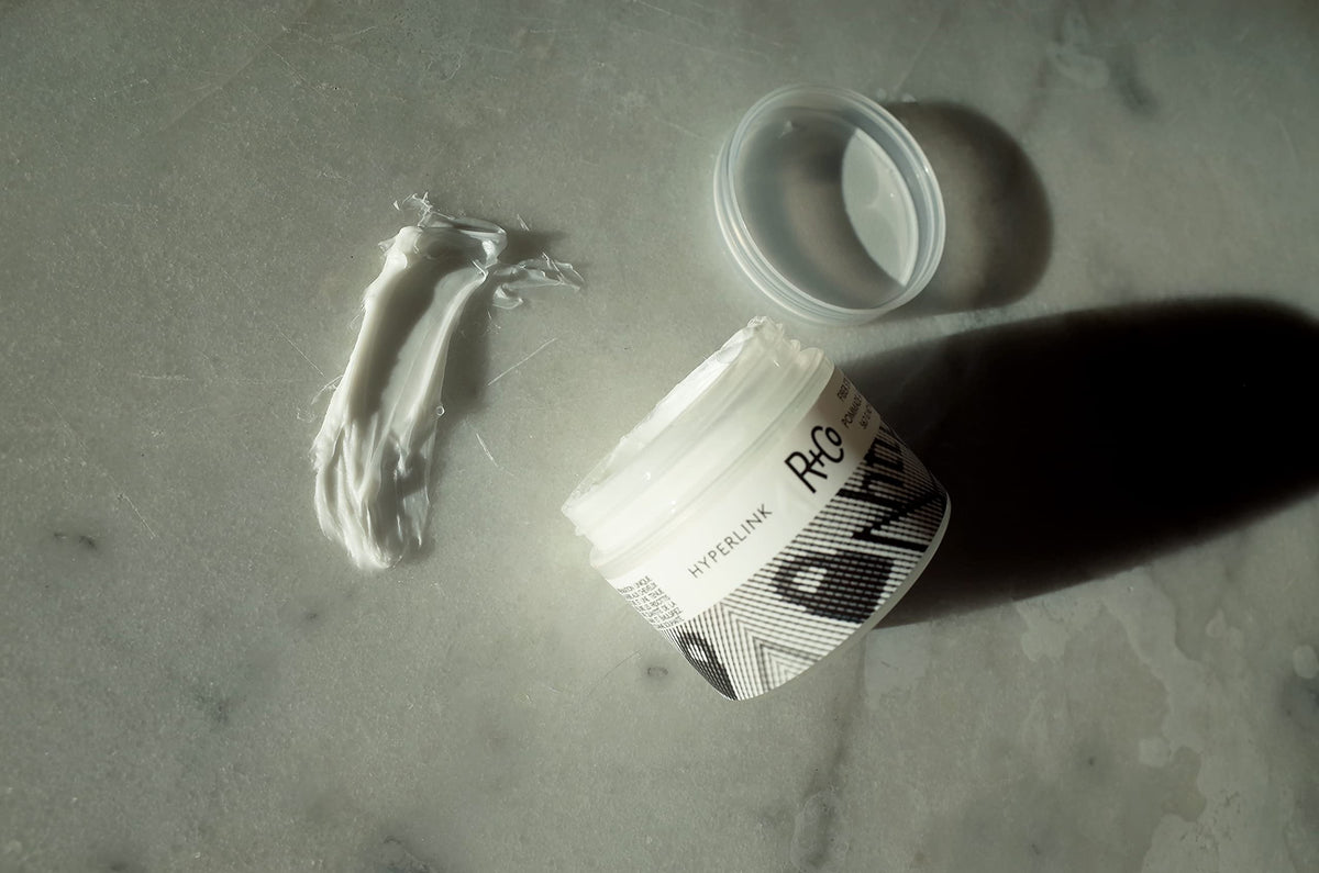 R+Co Hyperlink ingredient label closeup showing nourishing extracts for shine