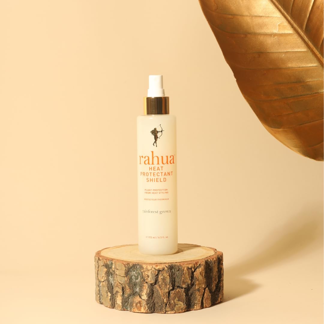 Rahua styling in use: stylist misting hair before blow-dry for smoother results