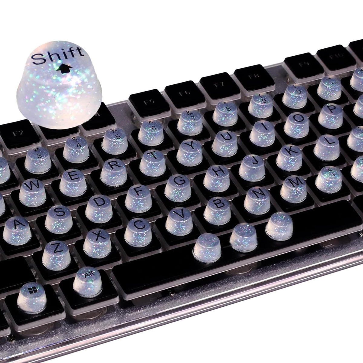 Raised Button front packaging displaying 64 clear glitter silicone keycaps and benefits