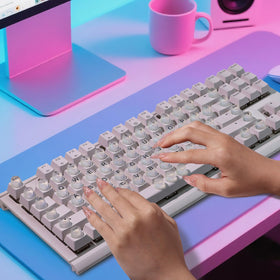 Raised Button next to hand for scale to show keycap height and fit on standard keys