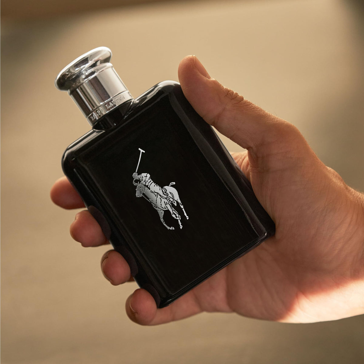RALPH LAUREN spritzing bottle demonstrating easy application and fine mist