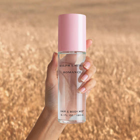 Ralph Lauren mist applied to hair demonstrating lightweight fragrance boost