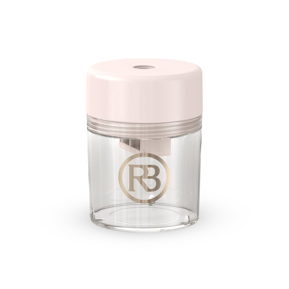 Ravie Beauty pink sharpener front view showing compact design and travel convenience