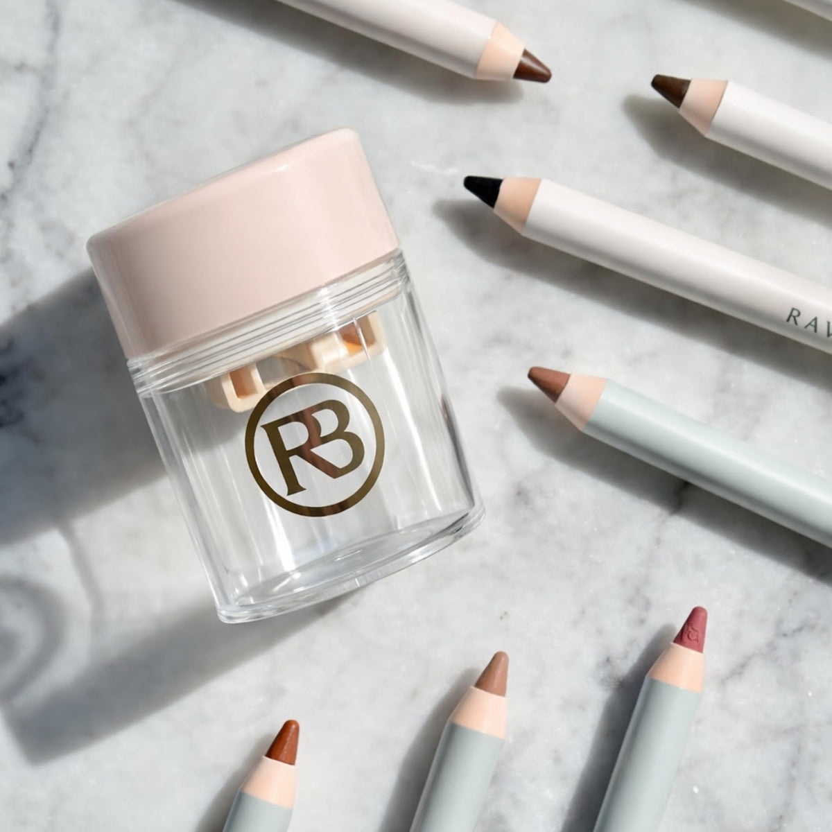 Ravie Beauty on vanity with cosmetics illustrating everyday grooming routines