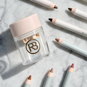 Ravie Beauty on vanity with cosmetics illustrating everyday grooming routines