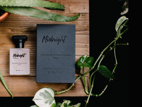RawChemistry Midnight bottle in hand showing real-world size and portability benefit