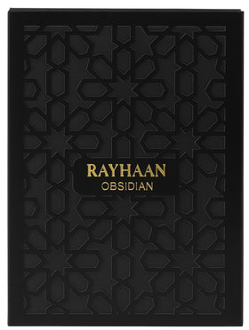 Rayhaan Obsidian sprayed on wrist in evening setting illustrating long-lasting warm woodsy trail