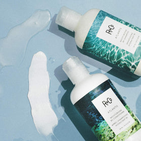 R+Co Atlantis bottle staged on bathroom shelf showcasing sustainable packaging