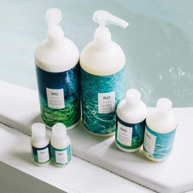 R+Co Atlantis creamy conditioner texture on hand demonstrating hydration benefit