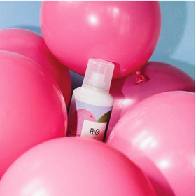 R+Co spray in hand to show 5oz scale and travel-friendly convenience benefit
