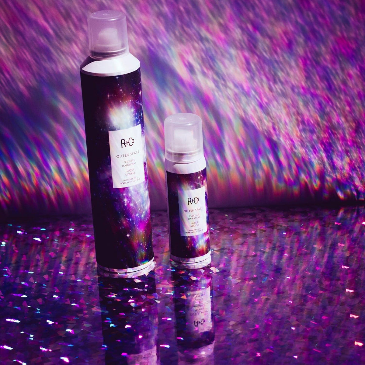 Model styled with R+Co Outer Space showing flexible, touchable hold
