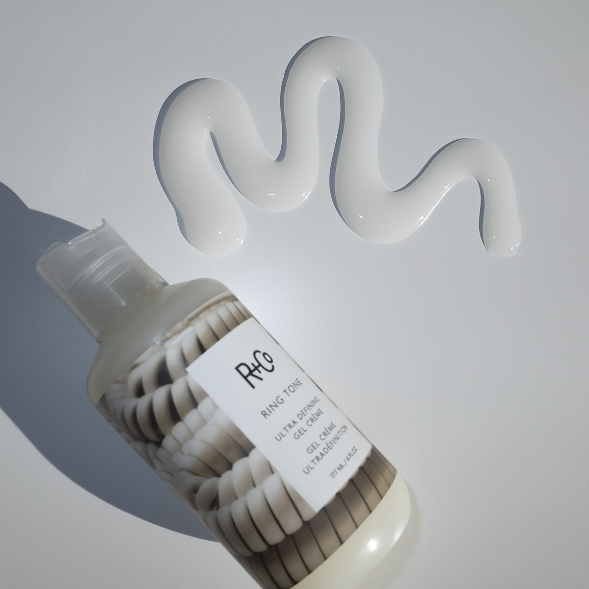 R+Co Ring Tone on bathroom shelf with toiletries showing daily styling convenience and style